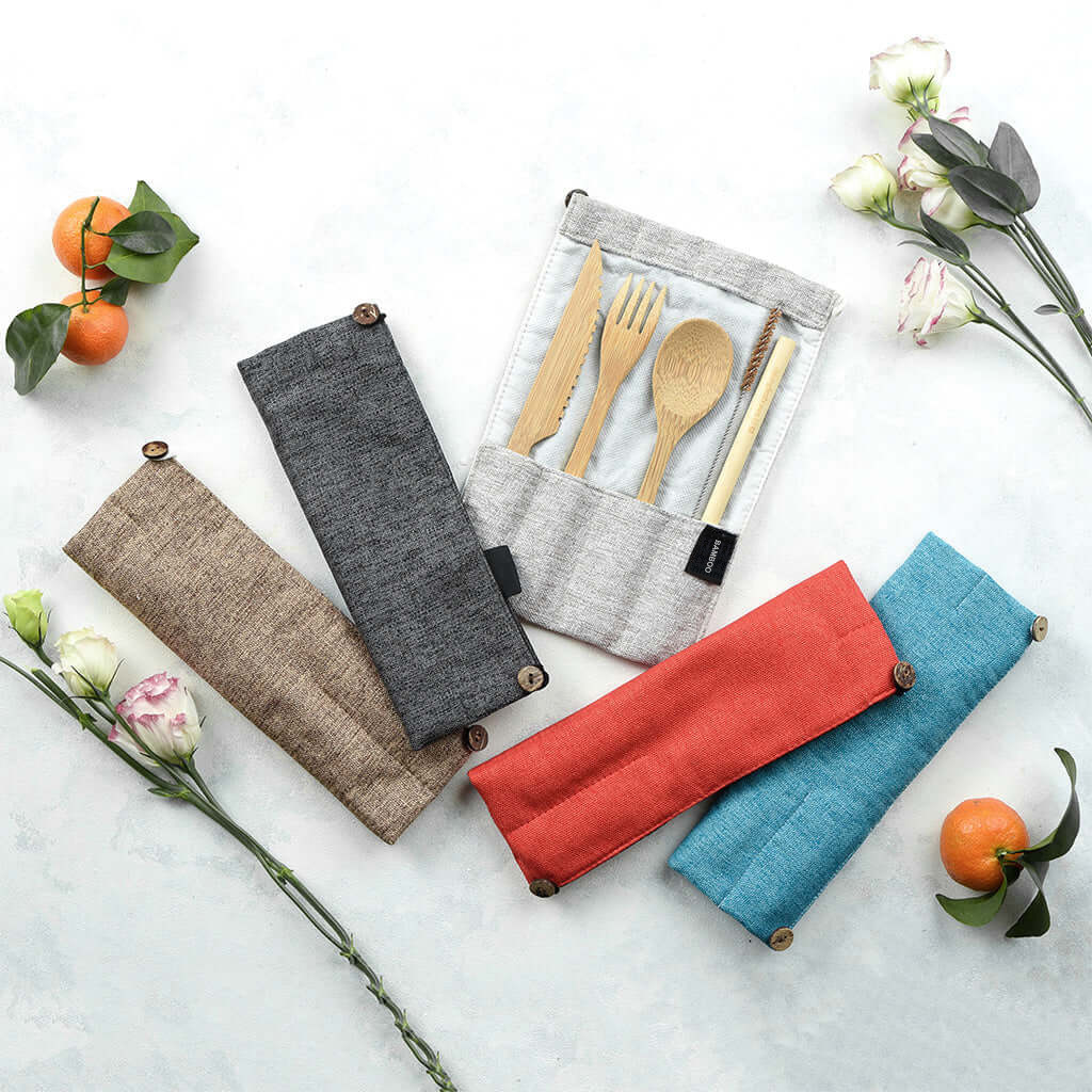 Reusable bamboo cutlery in colorful fabric travel pouches